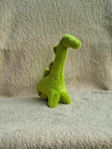 Small green plush Dinosaur from top