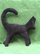 Big black plush Cat from side