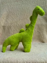 Big green plush Dinosaur from side